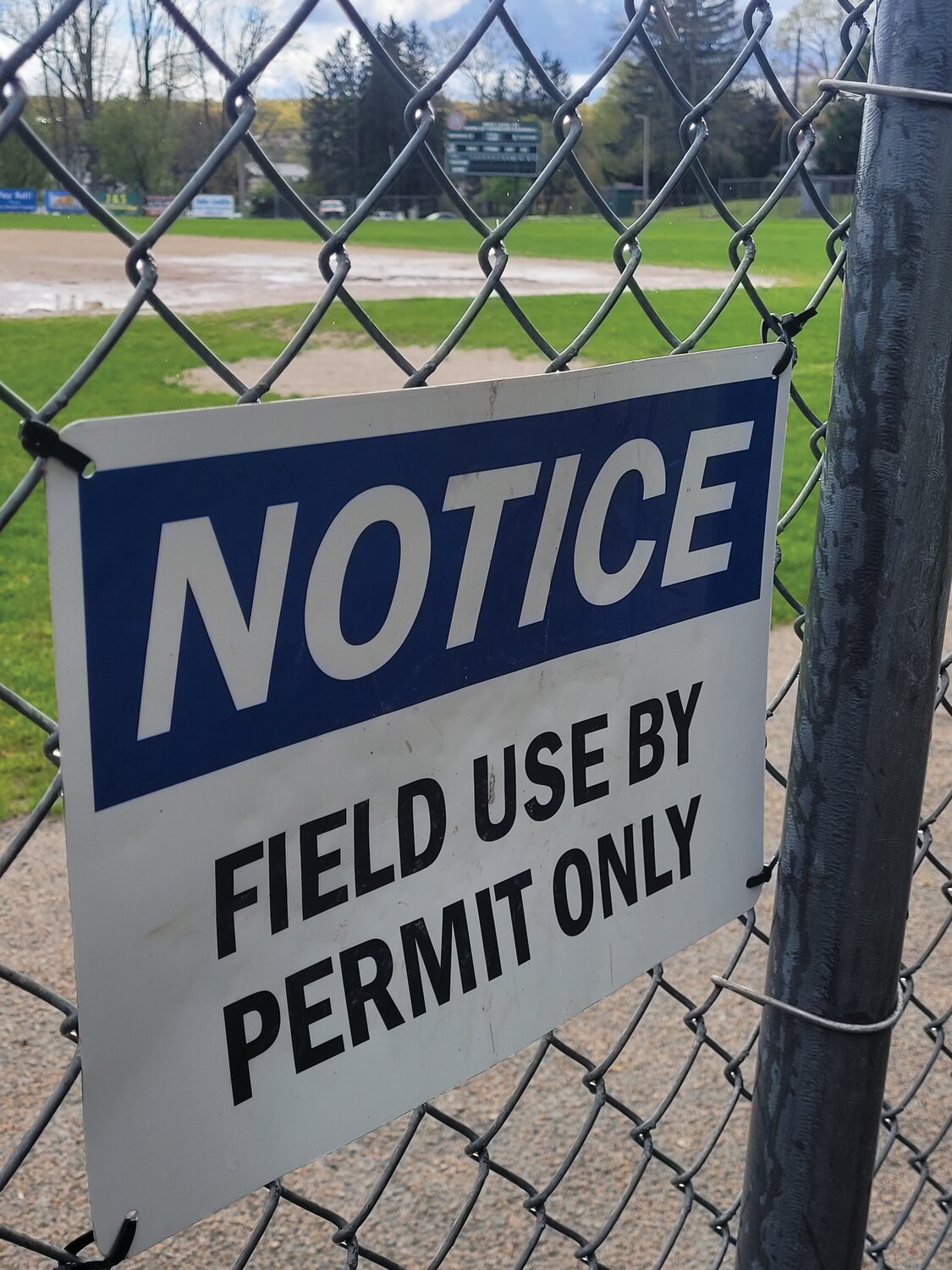 OPEN FOR PLAY? Johnston has been locking most of the town’s ballfields. One town councilman would like to see that policy change. The town’s director of buildings and grounds, however, says the locks keep out pooping dogs and their irresponsible owners.